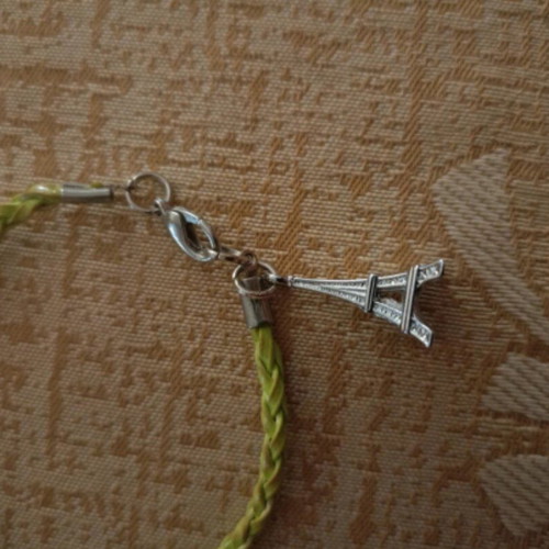 Bracelet like new green cord with metal Eiffel Tower charm