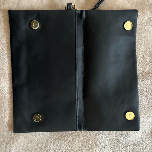 Handheld black clutch bag like new with leather detail