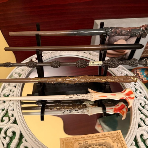 Harry Potter wand set of 5 like new with stand and gilded ticket