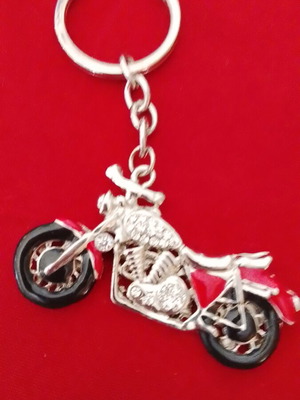 Metal keychain used with white transparent stone details