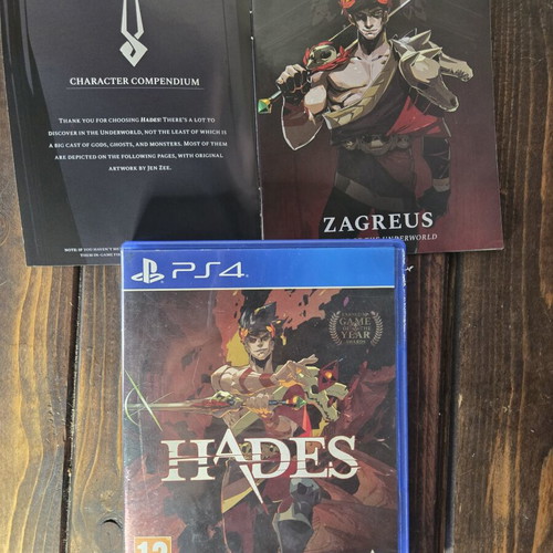 Hades PS4 game with booklet