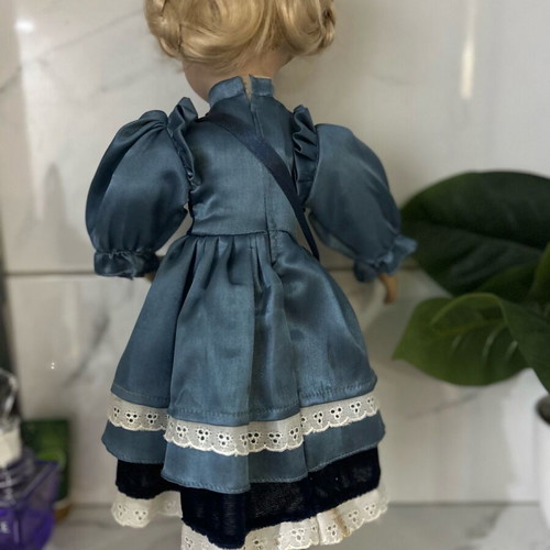 Porcelain doll like new vintage with blue satin dress