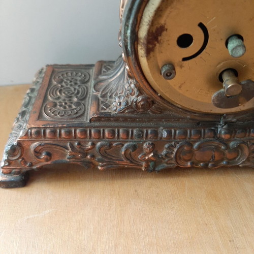 Copper German wind-up clock used with cathedral motif