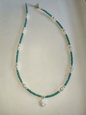 Handmade stainless steel necklace with blue and white beads