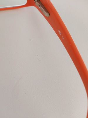 Myopia glasses frame used with embossed side surface