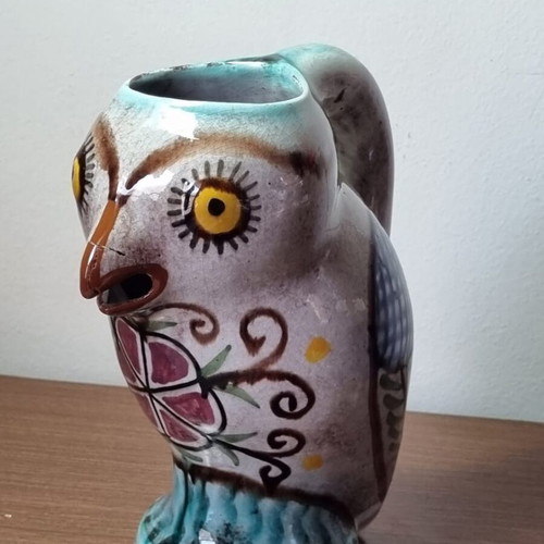 Ceramic owl pitcher used, broken and glued on the beak