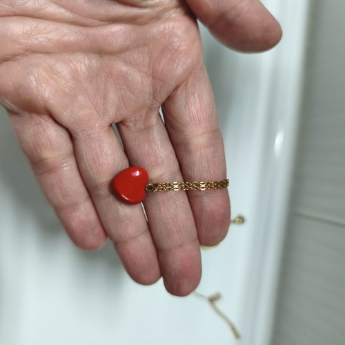 Two stainless steel necklaces like new, red and gold