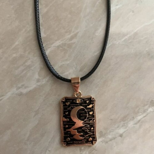 The Moon Tarot necklace like new, black and gold