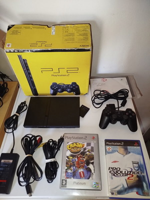 PlayStation 2 console with original controller, memory card and 2 games