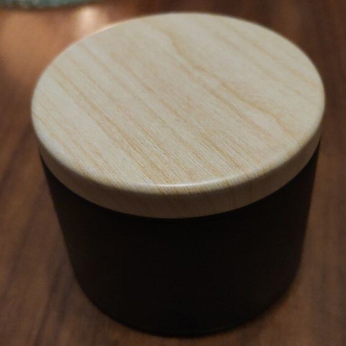 Wax melts in black matte metal container with choice of scent