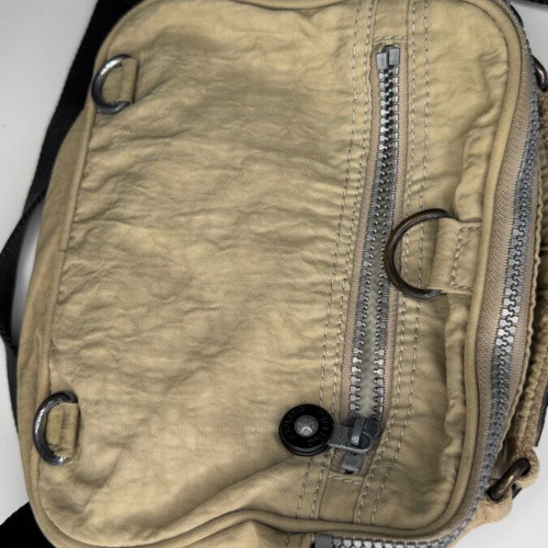 Kipling beige crossbody bag used with multiple compartments and strap