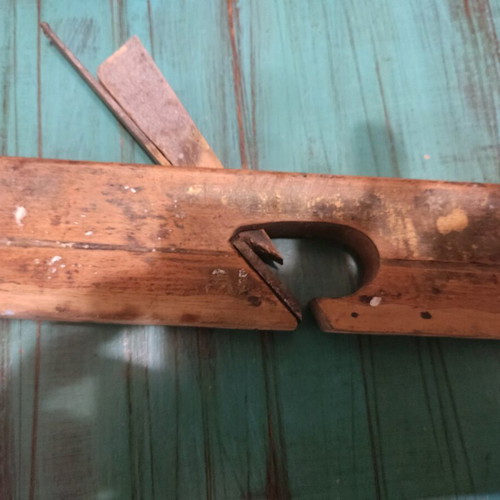 Wooden plane used with signs of wear, about 25 centimeters