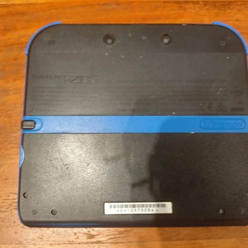 Nintendo 2DS used with stylus and charger