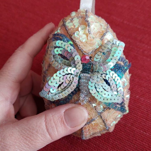 Handmade decorative egg like new with sequin embroidery and butterfly