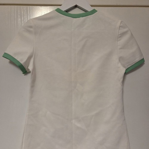 White blouse with green details, like new