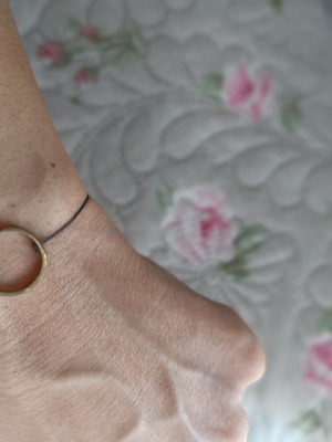 Bracelet with adjustable cord, like new, gray and gold