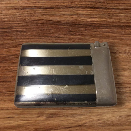 Vintage cigarette case with lighter used