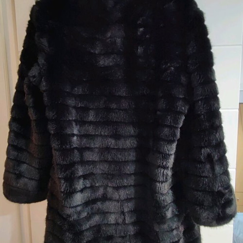Black faux fur with zipper and hoodie, like new, size M
