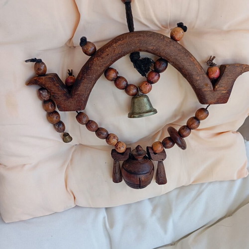 Asian decorative wooden item with brass bell used