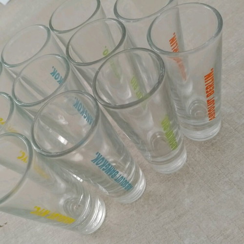 Collectible Absolut shot glasses with city names, like new