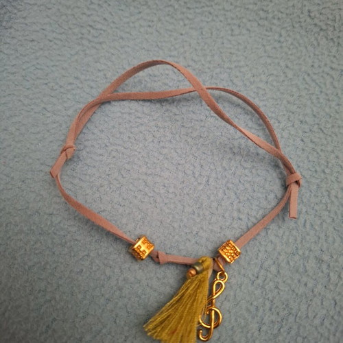 Bracelet with treble clef music note like new, multicolor