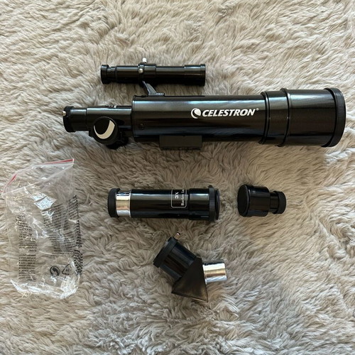 Celestron telescope new with equipment and accessories