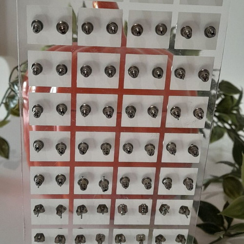 Stand with 36 pairs of stud earrings new, black