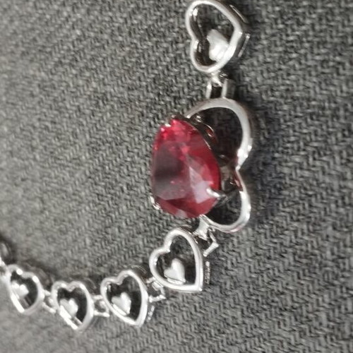 Women's bracelet with red crystal heart and silver elements, like new