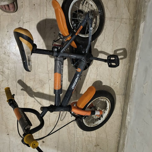 Tiger 12" children's bike used, orange Orient, needs rear tube