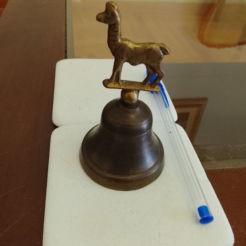 Vintage brass handbell with animal-shaped handle, used, functional