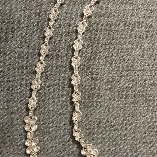 Riviera necklace with flower and four-leaf motifs, silver