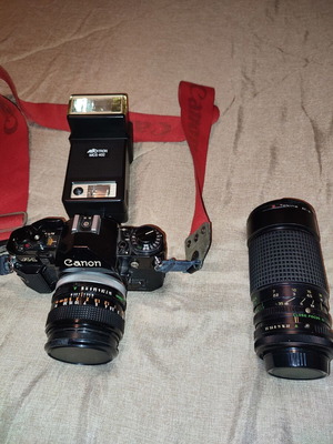 Canon A-1 35mm film manual focus SLR camera with Tokina 35-200mm lens and Alfotron MCS 402 flash used