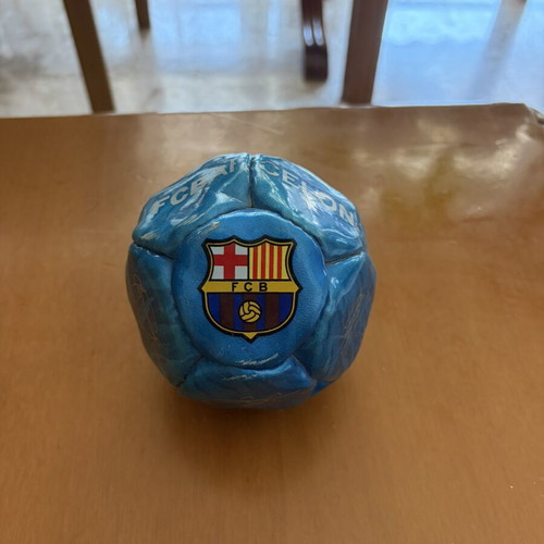 Decorative Barcelona ball with Messi, Xavi, Iniesta signatures