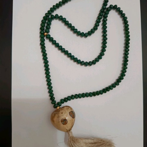 Necklace like new with green beads and large heart
