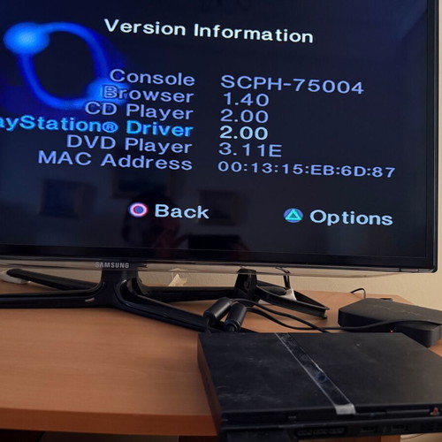 PlayStation 2 Slim console with original Sony accessories
