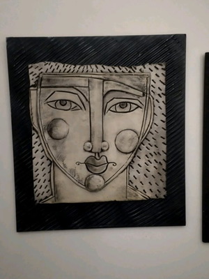 Clay artwork on wooden base handmade like new