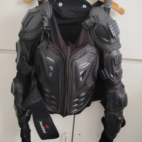 Perforated motorcycle jacket like new with plastic protections, medium size