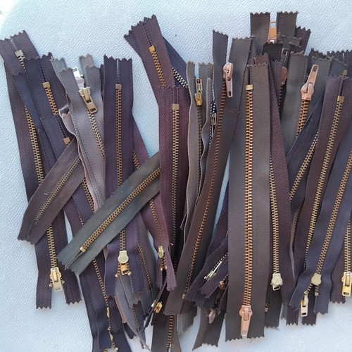 Metal and plastic sewing zippers YKK, assorted colors and sizes, pack
