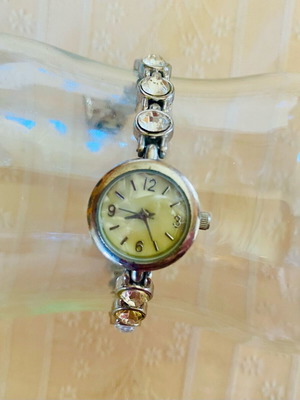 Vintage Avon women's silver-toned wristwatch used