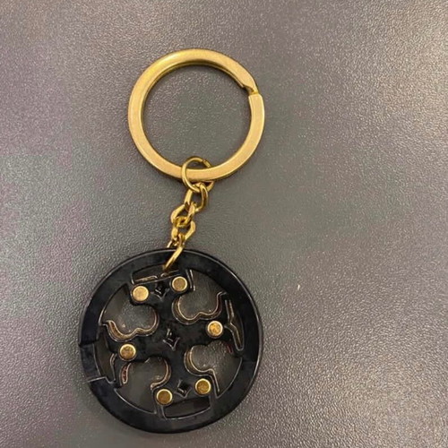 Tory Burch keychain like new, black and gold