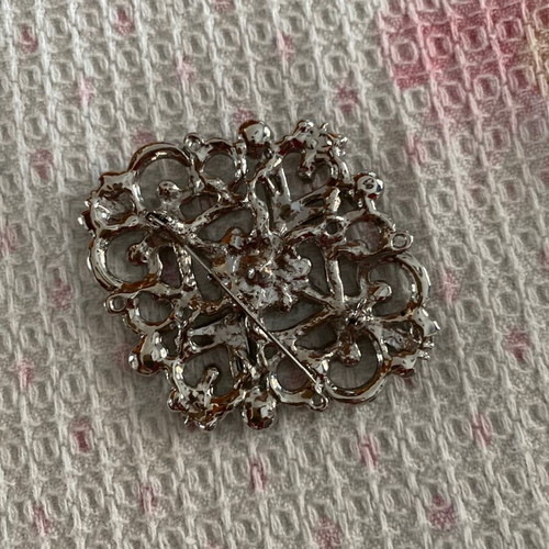 Silver brooch with stones