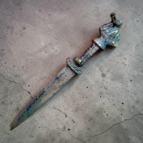 Vintage collectible letter opener with tsolias figure used