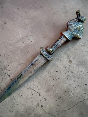 Vintage collectible letter opener with tsolias figure used
