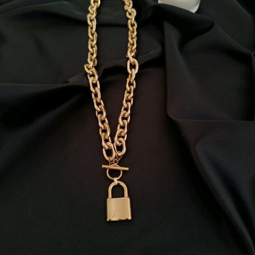 Gold chunky chain with steel padlock pendant
