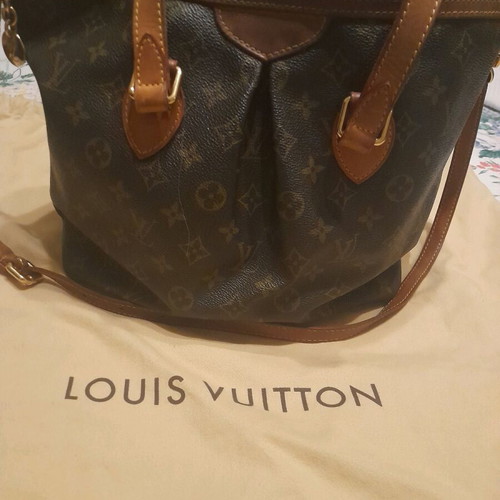 Louis Vuitton bag used with extra strap and storage pouch
