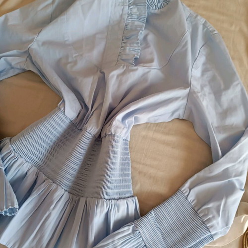 Blue shirt like new, size S with smocked waist and cuffs