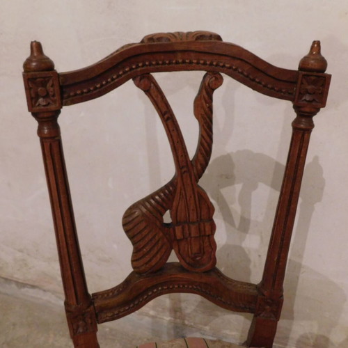 Pair of carved wooden chairs with striped fabric seat like new