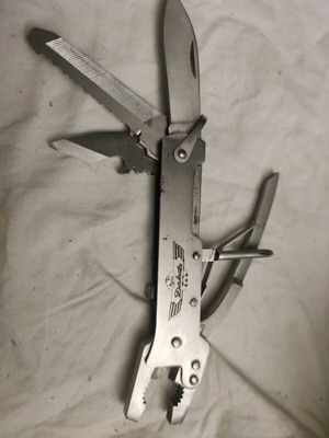 Vintage pliers from 1970s used, folding multipurpose stainless steel knife