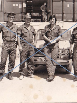 Black and white photo used, uniformed men with car 7.5x10.5 cm
