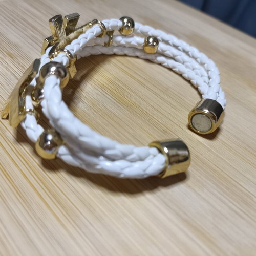 White and gold women's bracelet with rhinestones